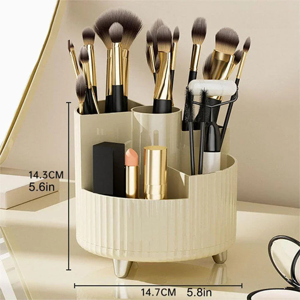 Rotating makeup brush holder organizer with gold-accented brushes and cosmetics on vanity