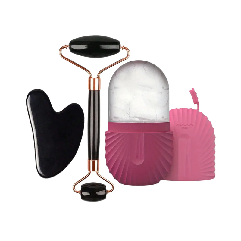 Black gua sha stone, jade roller, and pink ice facial roller massage tools on white background