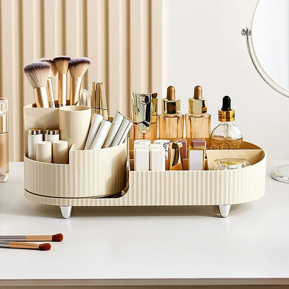 Cream makeup organizer on vanity with brushes, lipsticks, perfumes, and cosmetics.